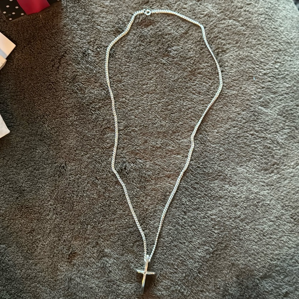 Sterling Silver 20” chain with cross.